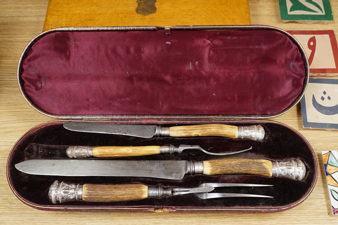 Four cased sets of silver plated flatware, including a carving set with antler handles, silver mounted.